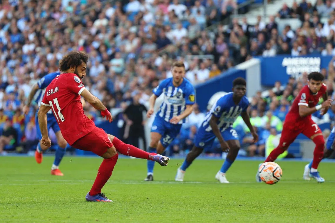 Liverpool's Mohamed Salah scores their second goal from the penalty spot.