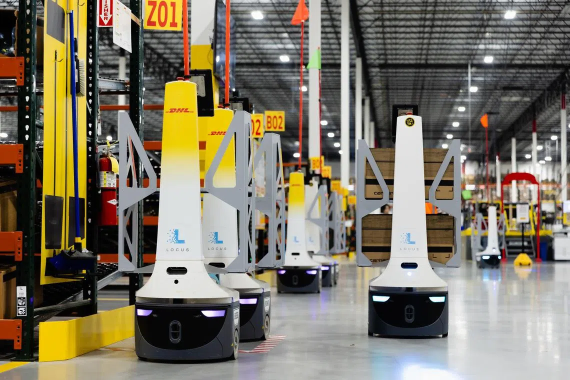 Ñ EMBARGO: NO ELECTRONIC DISTRIBUTION, WEB POSTING OR STREET SALES BEFORE 3:01 A.M. ET ON TUESDAY, NOV. 19, 2024. NO EXCEPTIONS FOR ANY REASONS Ñ Robots at a DHL facility in Columbus, Ohio, on Oct. 31, 2024. Even though robots are starting to take over some repetitive and cumbersome jobs, there are still many tasks they are not good at, making it difficult to know when or if robots will be able to fully automate this industry.  (Nick Fancher/The New York Times)