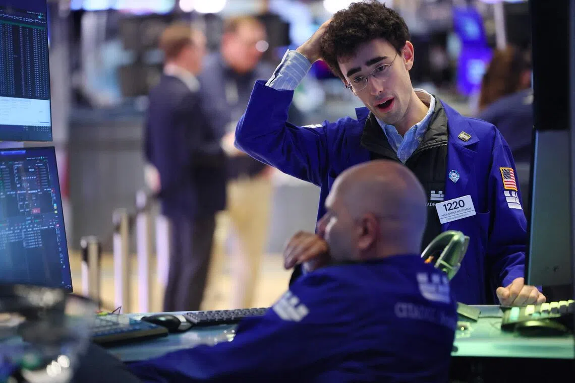 Traders working on the floor of the New York Stock Exchange during afternoon trading on March 3, in New York City.