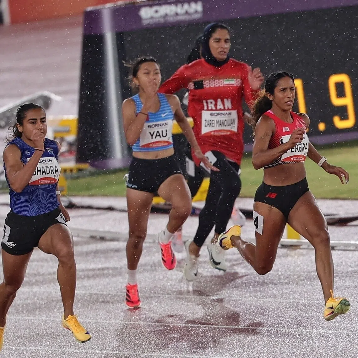 Shanti Pereira of Singapore en route to finishing first in the Asian Games Athletics Women’s 200m heats at the Paloma Mizuho Stadium in Nagoya, Japan on Sept 26.