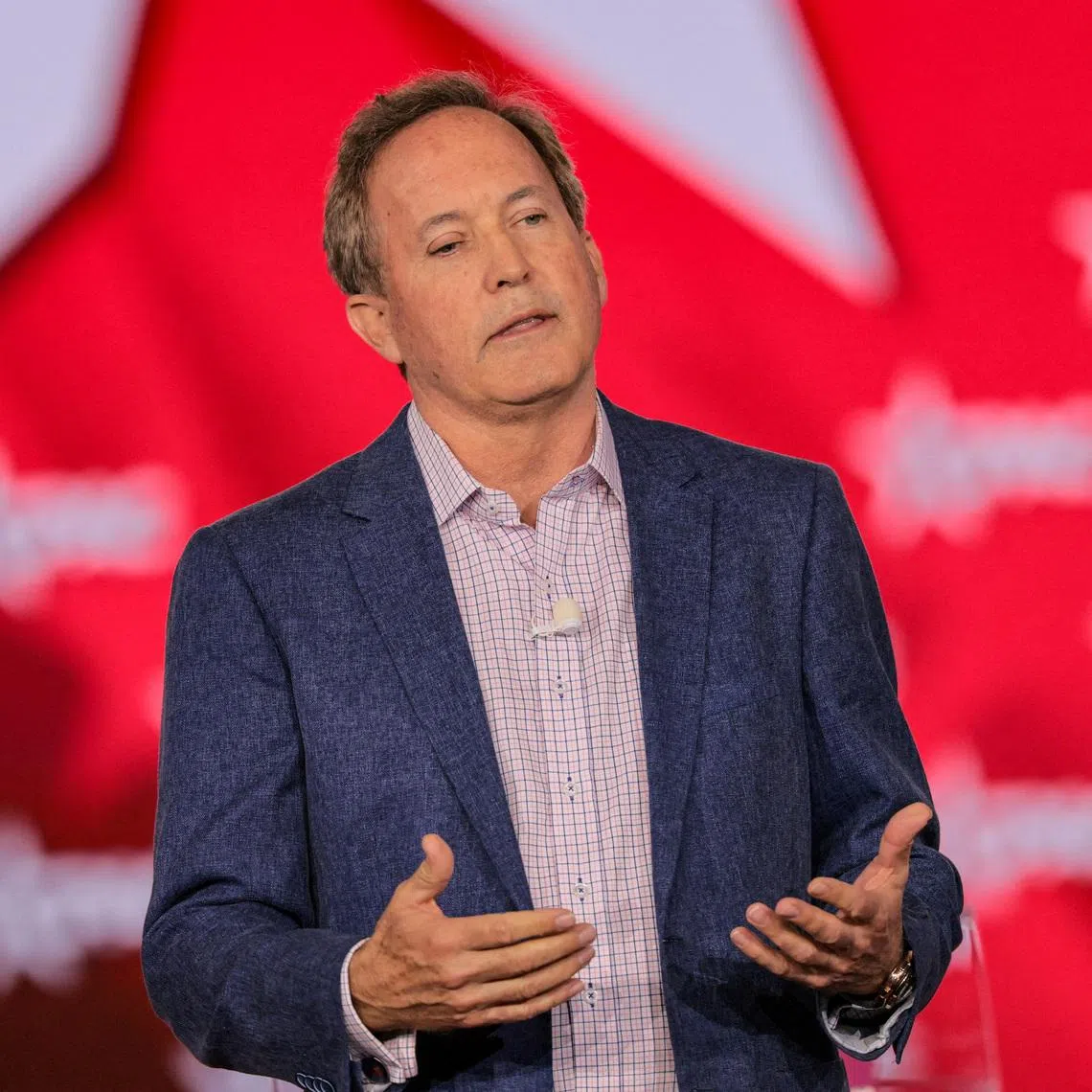 FILE PHOTO: Texas Attorney General Ken Paxton speaks during the Conservative Political Action Conference (CPAC) USA 2026 at the Gaylord Texan Resort and Convention Center, in Grapevine, Texas, U.S., March 28, 2026.  REUTERS/Daniel Cole/File Photo