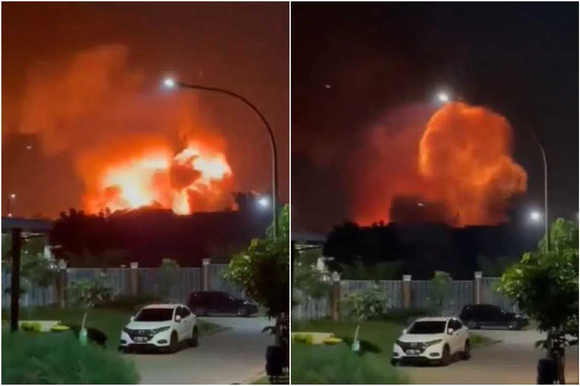 The fire caused a series of explosions and sent flames and smoke into the night sky.