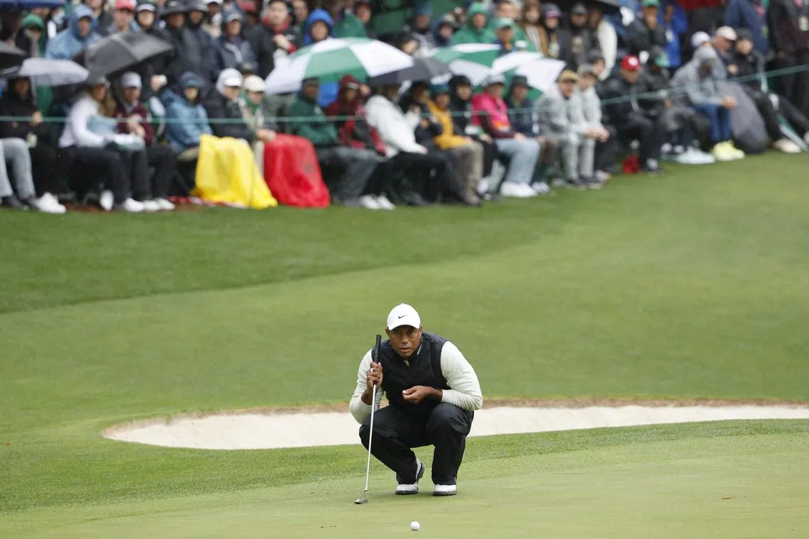 Tiger Woods lines up a shot on the 16th green, during the second round of the Masters Tournament.