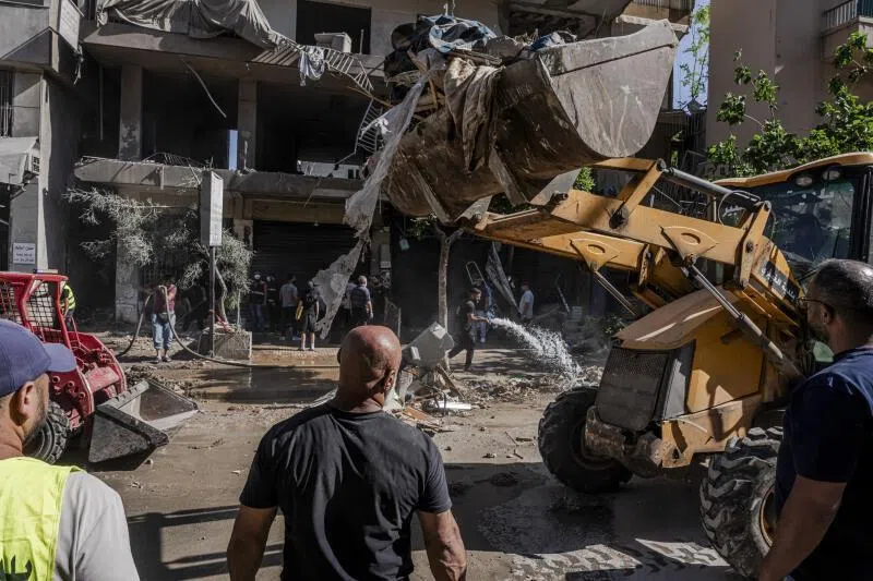 Debris being cleared at the site of an Israeli strike that targeted a residential building in Dahiyeh, in southern Beirut, Lebanon, on June 14.