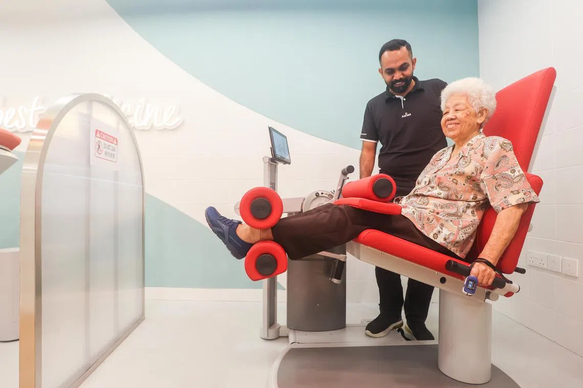 Awwa senior therapy assistant Mr Suresh assisting acute decompensated heart failure patient Madam Wong Siew Sin @ Wong Siew Kin, 86, with light exercises at the Awwa Centre in  Ang Mo Kio as part of the Air Master service. Air Master - launched by Lien Foundation and Tan Tock Seng Hospital in collaboration with Awwa, Ren Ci Hospital and St Luke's Eldercare - aims to help patients with chronic lung and heart conditions learn to manage their breathlessness and other symptoms as part of the $5.8 million Breathlessness Ecosystem initiative. 