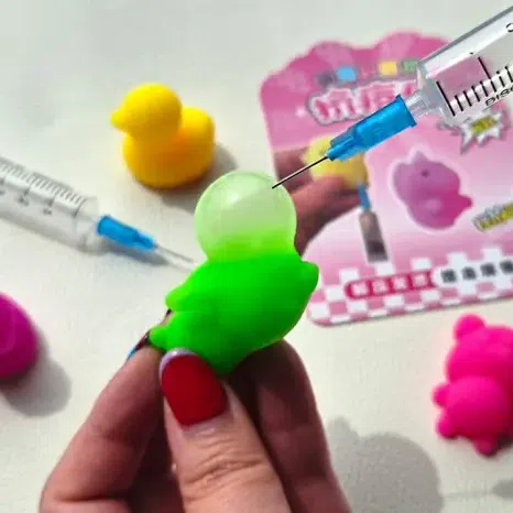 Online tutorials show users injecting air or liquid into the jelly-like toy using a syringe. 