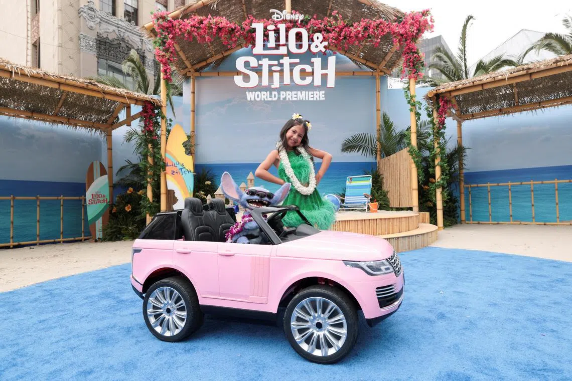 Maia Kealoha and Stitch attend a premiere for the film Lilo & Stitch in Los Angeles, California, on May 17, 2025. 