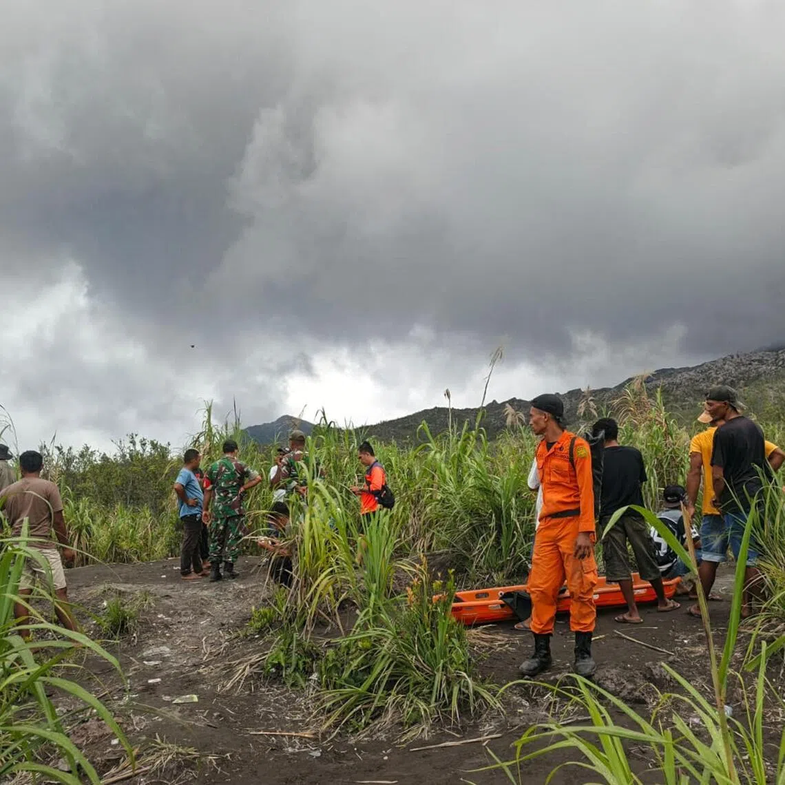 Rescue workers standing by after the volcanic eruption of Mount Dukono in North Halmahera, North Maluku, on May 8. 