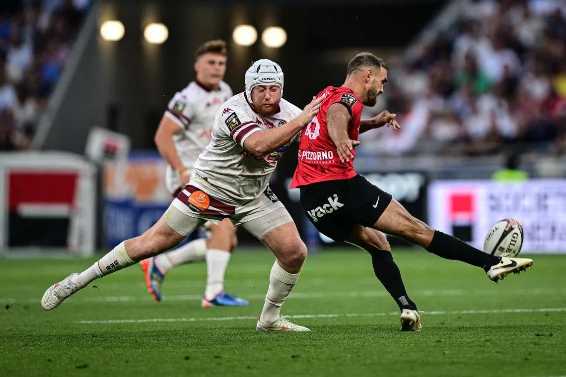 Bordeaux-Begles hooker Maxime Lamothe tackling Toulon fullback Melvyn Jaminet in the French Top 14 semi-final at the Groupama Stadium on June 21, 2025.