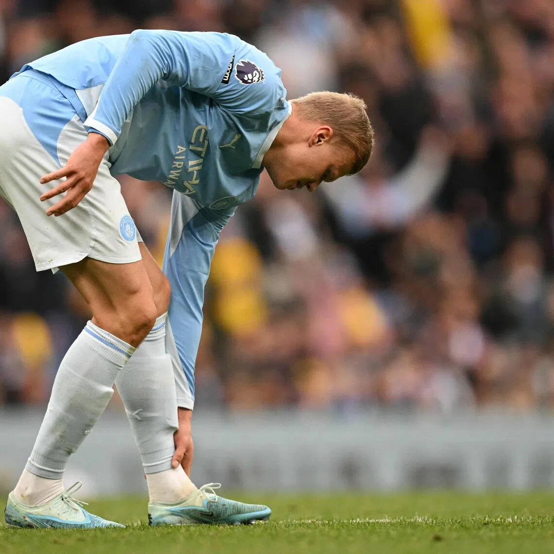 Manchester City’s Erling Haaland holding his leg after vying for the ball with Ipswich Town’s Jack Clarke during the Cityzens’ 3-2 win in an EPL match on Oct 17.