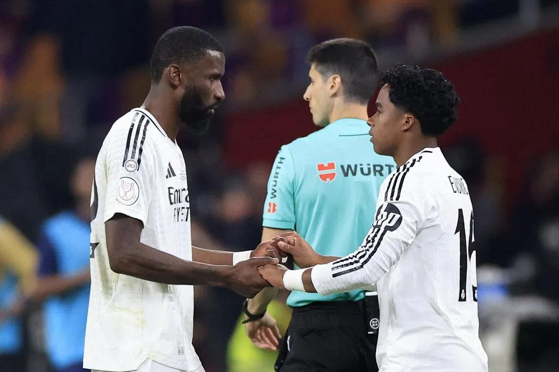 Real Madrid's Endrick (right) comes on to replace Antonio Rudiger in the Copa del Rey final against Barcelona at Estadio de La Cartuja in Seville, Spain on April 27, 2025. Rudiger was red carded by the referee for throwing an object at him over a decision.