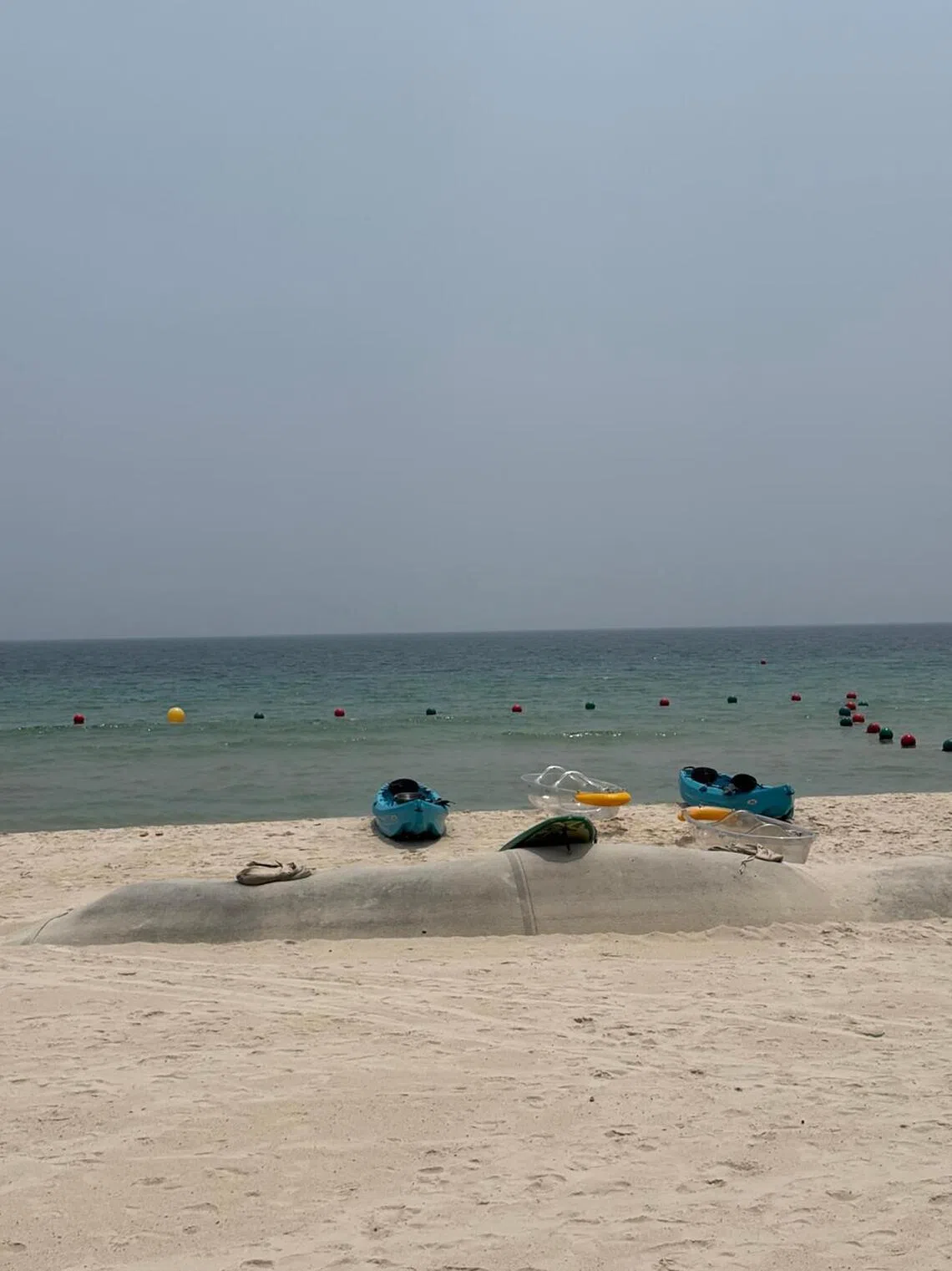 Kayaks line the beach at Sonada Beach Club.