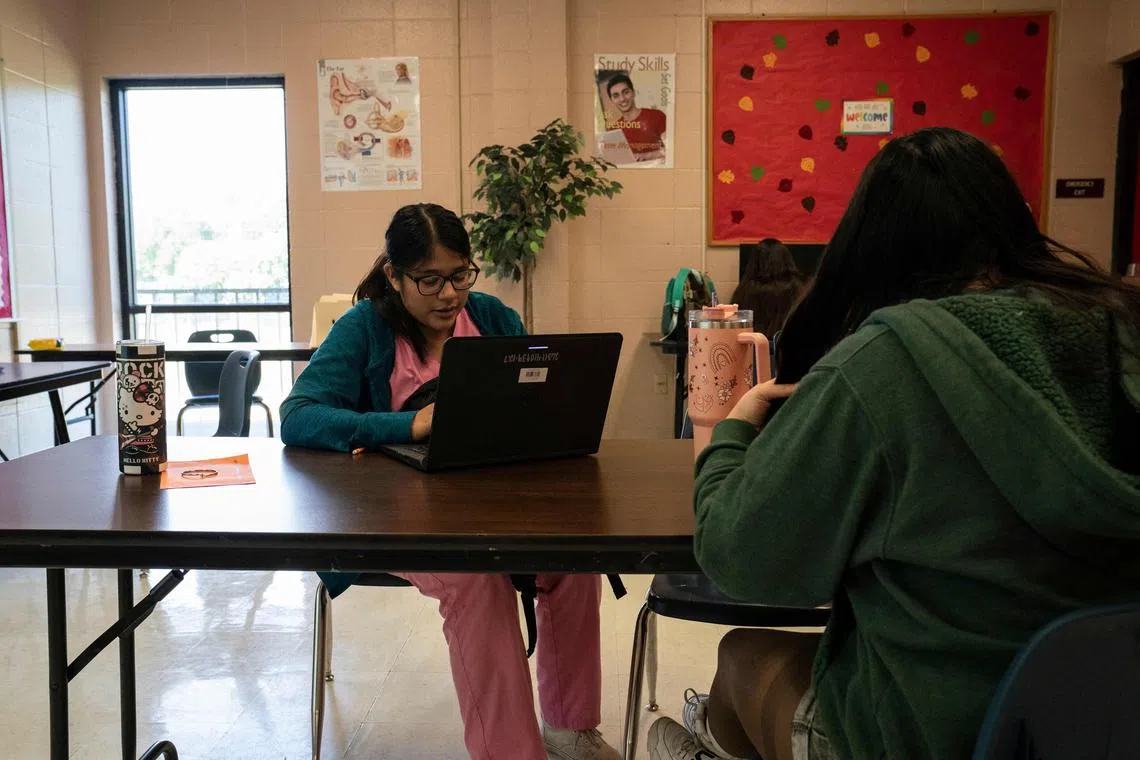 Ms Yarezi Alvarado, 17, who has a one-year-old daughter that attends the school’s daycare, works on an assignment at Lincoln Park High School, a school for pregnant students and young mothers, in Brownsville, Texas, on Nov 2, 2023.  