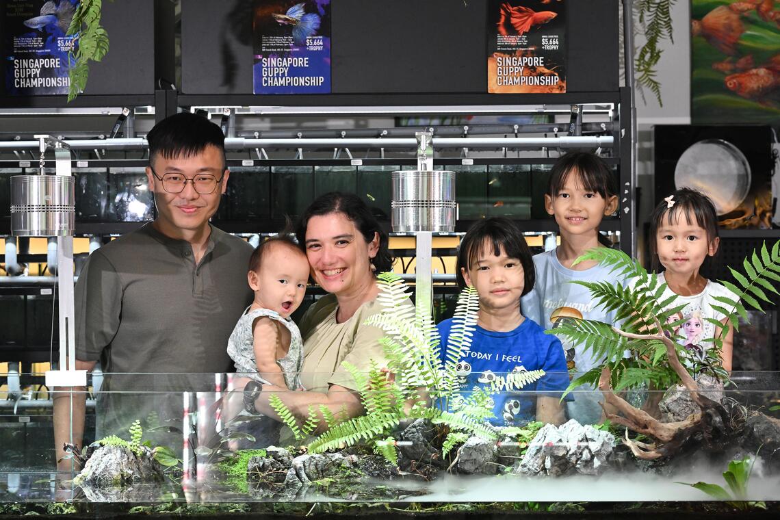 ST20250906-202542000129-Lim Yaohui-Venessa Lee-vllarge/

Mr Jonathan Poh​, 42​, Owner of ​Nature Therapy Studio​, and his wife, Ms Selena Vera Hey​, 41​, ​Teacher​, with their four daughters, Naomi Helen Poh Yi Qing​, (second from right) 8, ​pri​mary ​three pupil; Natalie Susan Poh Yi Ning​, (third from right) 7​, pri​mary ​one pupil; Natasha Eunice Poh Yi Ling​, (extreme right) 3​, in ​nursery two; and Nadya Francine Poh Yi Ting​, ​1, at his shop in Kitchener Complex​ on Sept 6, 2025. 

The govt's Large Families Scheme credits kick off in Sept. Interview with parents of large families, defined as having 3 or more kids, about their bargain-hunting, money-saving tips for large families

(ST PHOTO: LIM YAOHUI)