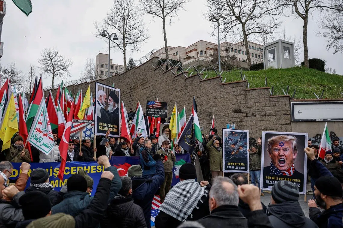 Demonstrators gather outside the U.S. Consulate General to show their solidarity with the Iranian people, amid recent tensions between the United States and Iran, in Istanbul, Turkey, February 1, 2026. REUTERS/Kemal Aslan