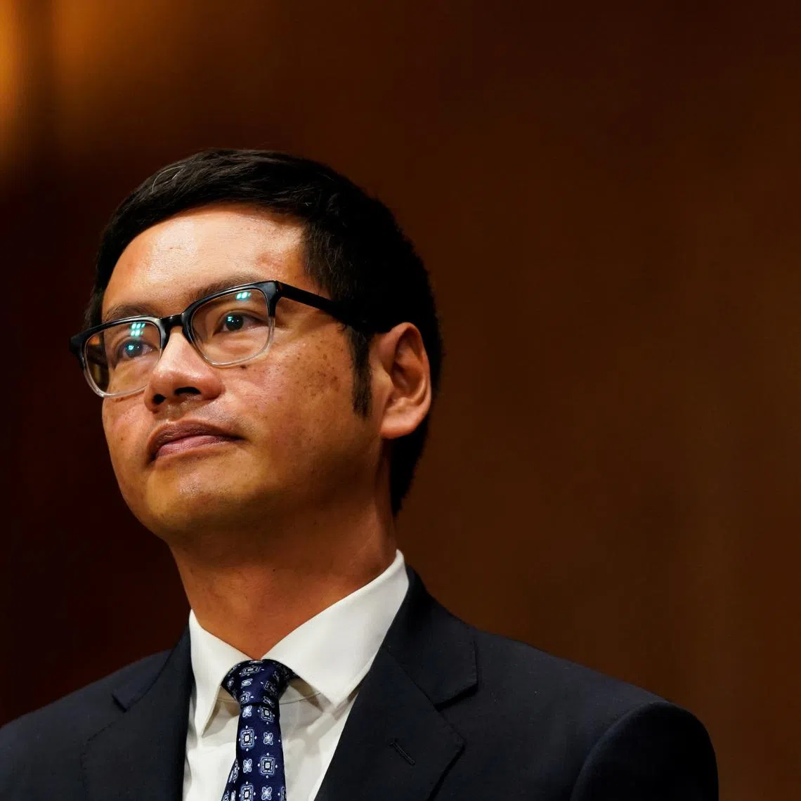 FILE PHOTO: Dale Ho, a voting rights advocate with the ACLU nominated to become a federal district court judge in Manhattan, prepares to give his opening statement during a U.S. Senate Judiciary Committee hearing on Capitol Hill in Washington, U.S., December 1, 2021. REUTERS/Elizabeth Frantz/File Photo
