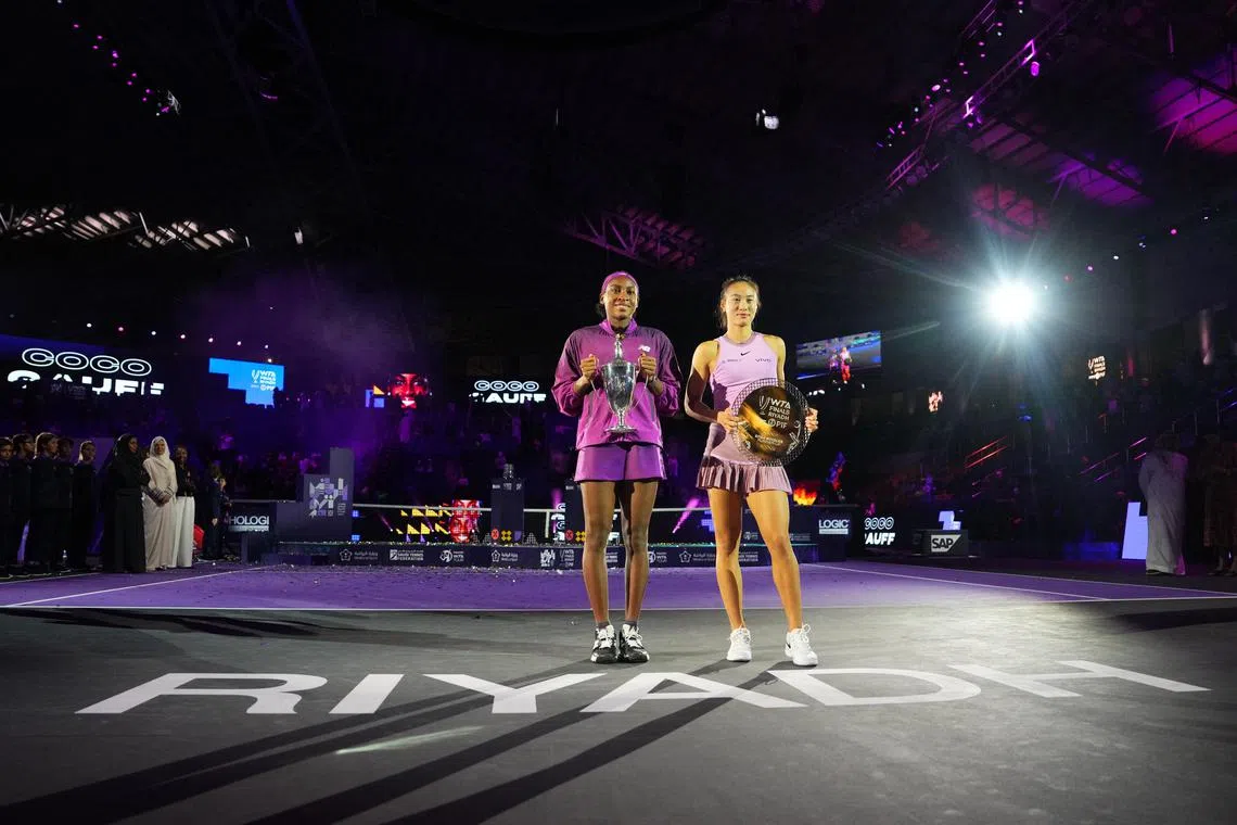 Coco Gauff (left) of the United States celebrating with the trophy after winning the women's singles final against China's Qinwen Zheng at King Saud University Indoor Arena in Riyadh, Saudi Arabia, on Nov 9.