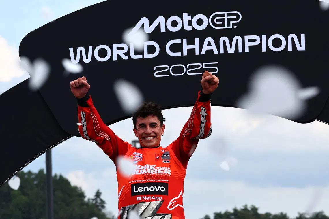 MotoGP - Japanese Grand Prix - Mobility Resort Motegi, Motegi, Japan - September 28, 2025 Ducati Lenovo Team's Marc Marquez celebrates on the podium after winning the 2025 MotoGP World Championship REUTERS/Kim Kyung-Hoon