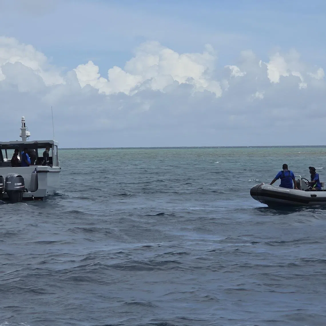 Divers conducting search and recovery operations for the bodies of four Italian divers in the waters of Vaavu Atoll, Maldives, on May 19.