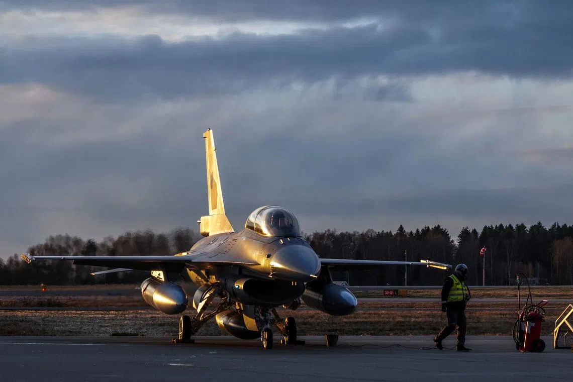 FILE PHOTO: A pilot sits inside the jet aircraft as Norway marks the first delivery of used F-16 fighters to Romania at Rygge air station, Norway November 28, 2023. NTB/Ole Berg-Rusten via REUTERS/File Photo