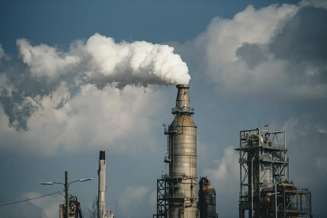 FILE -- A refinery in Houston, Texas, Feb. 14, 2023. The Securities and Exchange Commission is expected on Wednesday to approve new rules detailing if and how public companies should disclose climate risks and how much greenhouse gas emissions they produce, but there are fewer demands on businesses than the original proposal made about two years ago. (Meridith Kohut/The New York Times) 