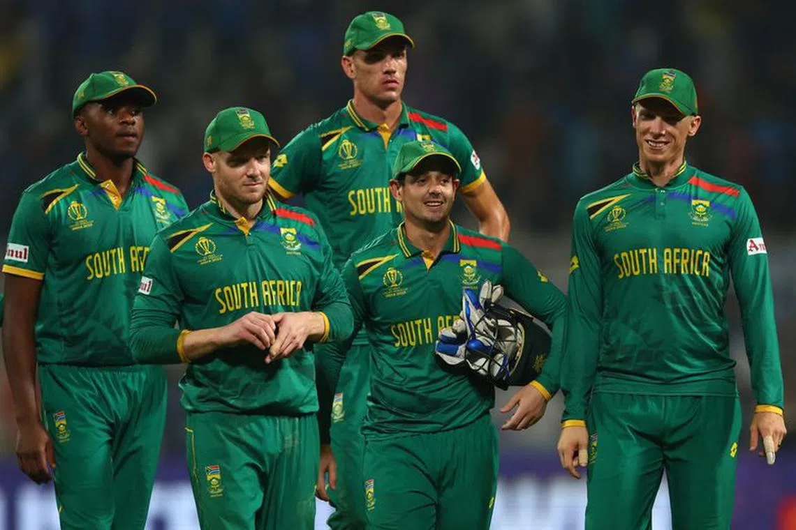 Cricket - ICC Cricket World Cup 2023 - Semi-Final - South Africa v Australia - Eden Gardens, Kolkata, India - November 16, 2023 South Africa's Quinton de Koc, David Miller and teammates after the match REUTERS/Andrew Boyers/File Photo