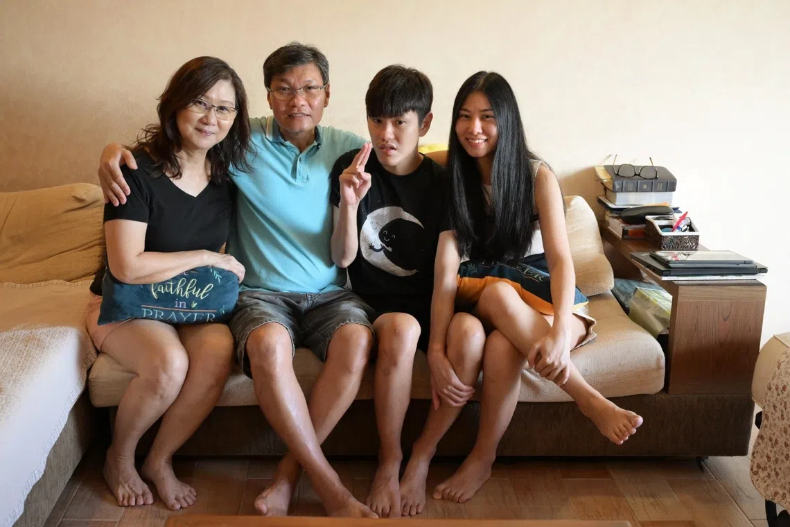 Mr Ryan Lim (3rd from left) with (from left) his mother Rosalind Lim, father Roland Lim and younger sister Rachael.