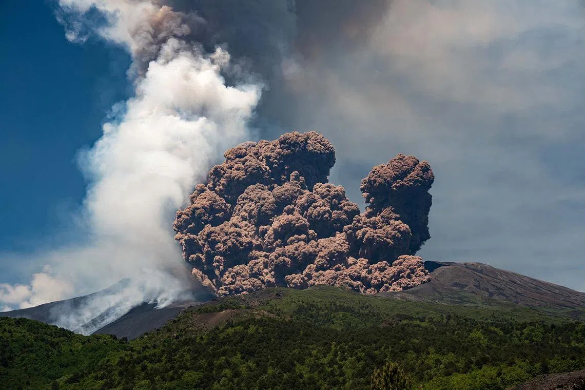 Volcanic steam rising from Mount Etna, as seen from Milo, Italy, June 2, 2025. 