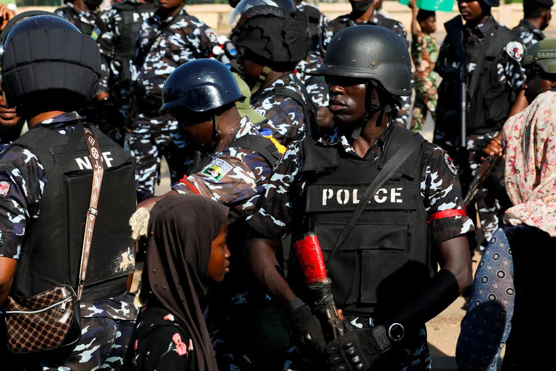 Nigerian security forces stand guard during the third day of anti-government demonstrations against bad governance and economic hardship in Lagos, Nigeria August 3, 2024. REUTERS/Francis Kokoroko
