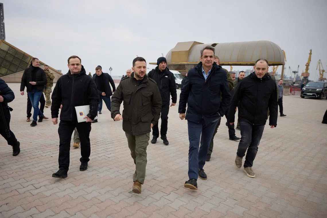 FILE PHOTO: Ukraine's President Volodymyr Zelenskiy and Greek Prime Minister Kyriakos Mitsotakis visit the sea port, amid Russia's attack on Ukraine, in Odesa, Ukraine March 6, 2024. Ukrainian Presidential Press Service/Handout via REUTERS/File Photo