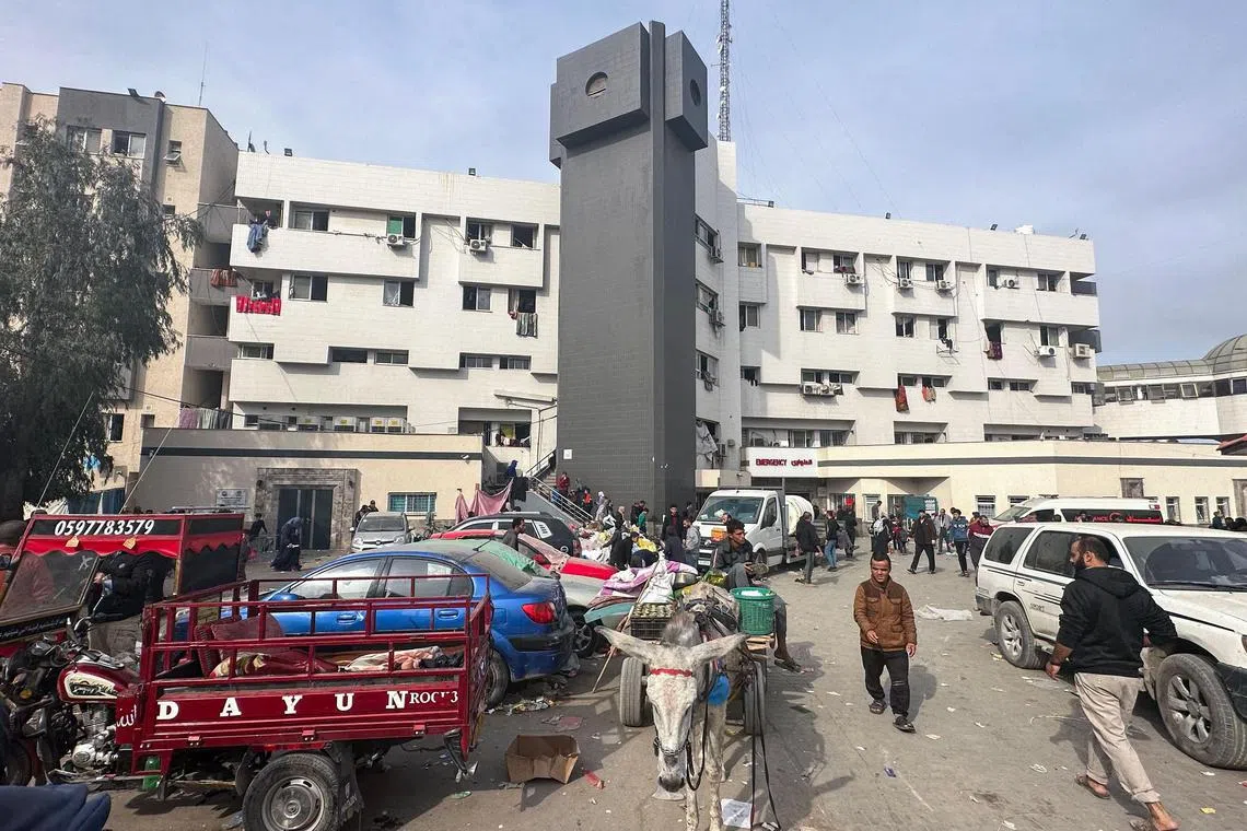 Displaced Palestinians gather in the yard of Gaza's Al Shifa hospital on Dec 10.