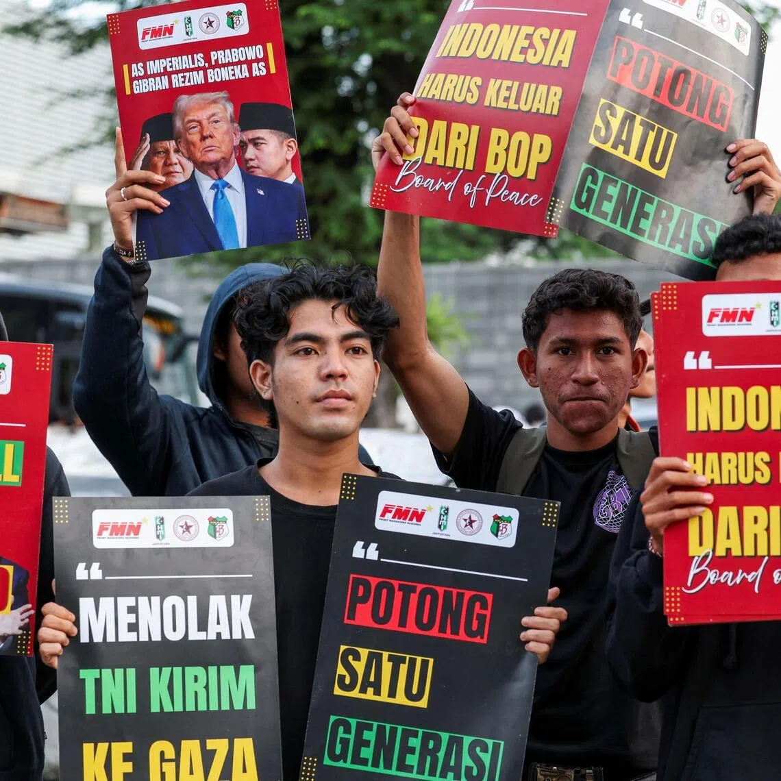 People in Indonesia take part in a protest outside the US Embassy, urging the Indonesian government to revoke its membership from the Board of Peace. 