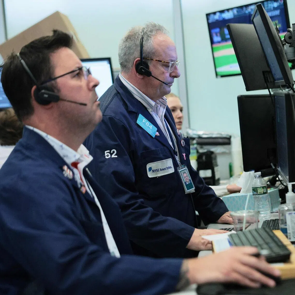 Traders working on the floor of the New York Stock Exchange during afternoon trading on June 10, 2026 in New York City. Stocks were significantly down at the closing of the market. 