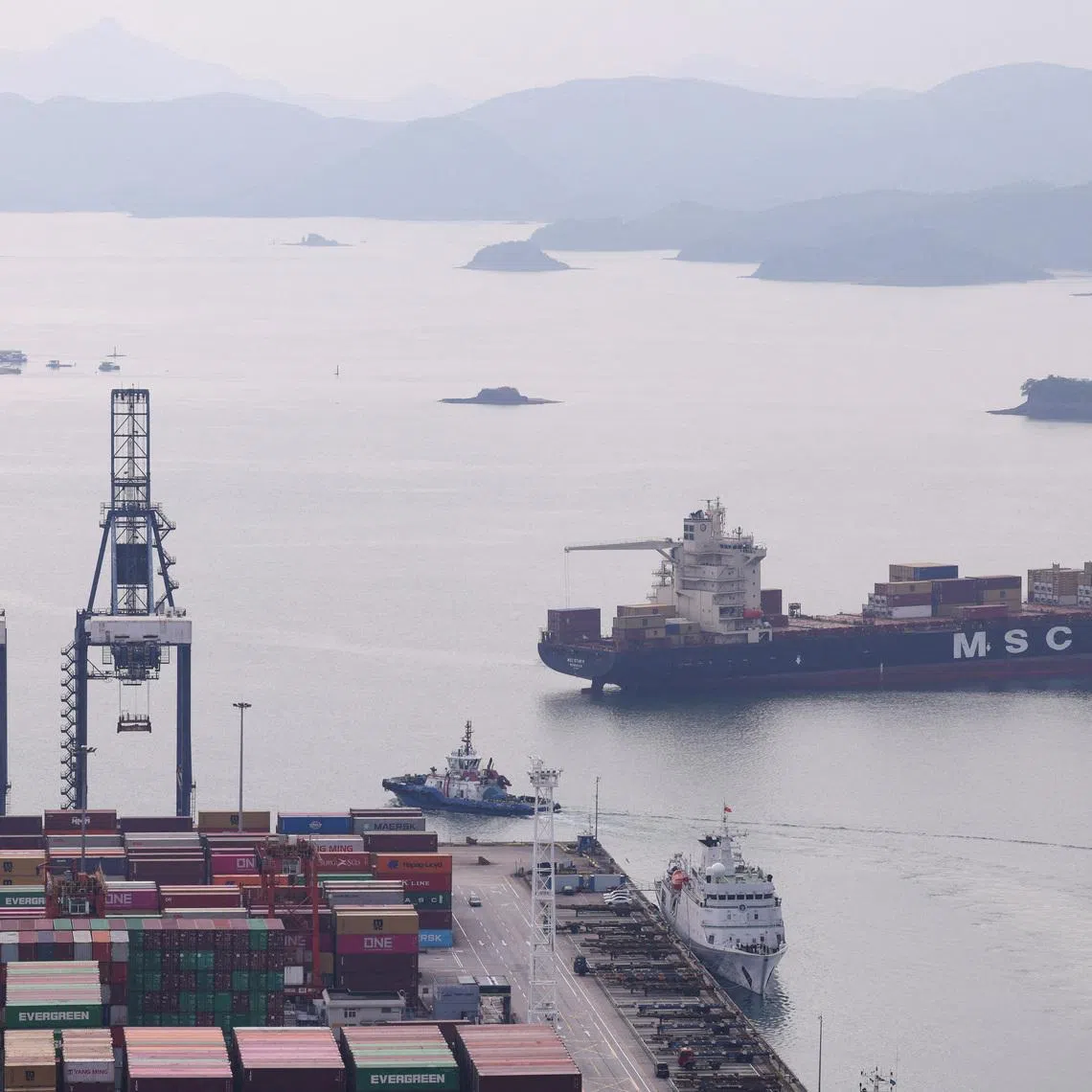 FILE PHOTO: A cargo ship carrying containers approaches a terminal of the Yantian port in Shenzhen, Guangdong province, China October 30, 2025. REUTERS/Tingshu Wang/File Photo