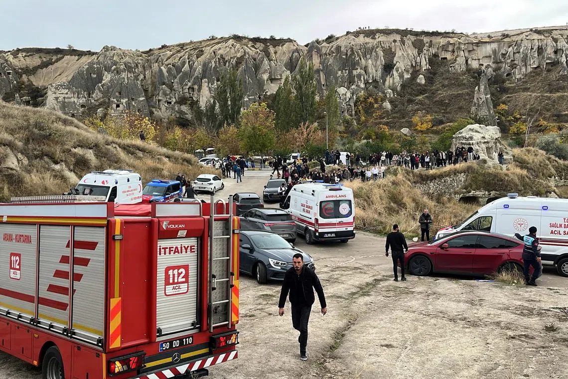 A fire truck and ambulances are parked near the scene after rocks fell from a fairy chimney, a volcanic rock formation, following heavy rainfall in Goreme, in central Cappadocia region, Turkey, October 29, 2026. Ihlas News Agency via REUTERS