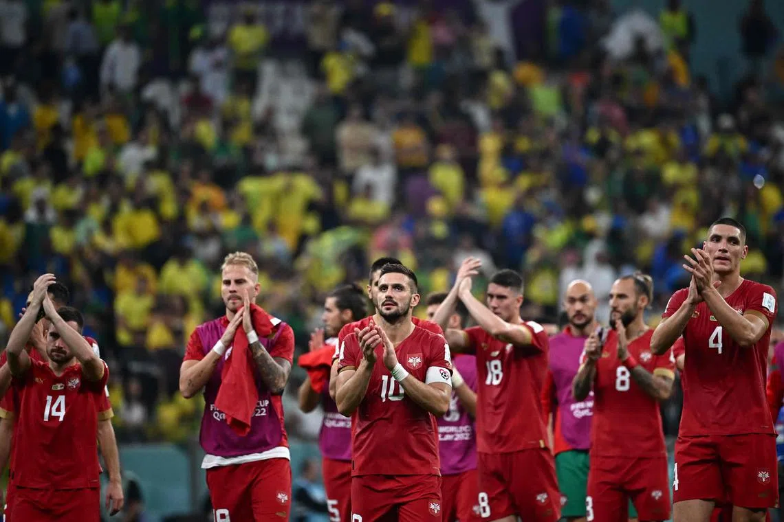 Serbia's players applauding the crowd after losing 2-0 to Brazil on Nov 24.
