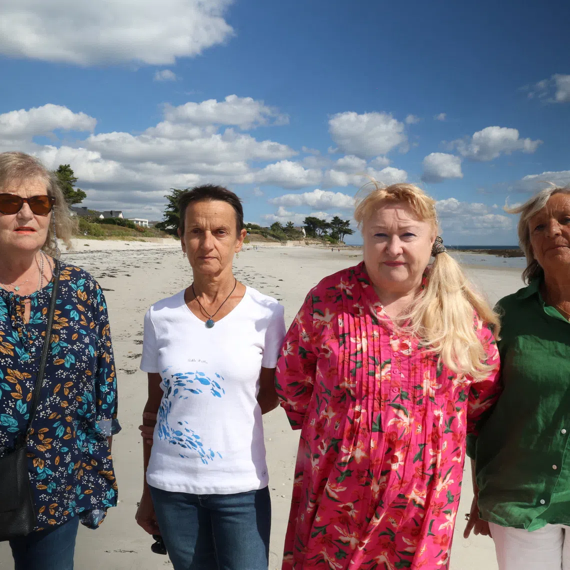 Michele Le Reun-Gaigne, Ghislaine Magoarou, Raymonde Vilar-Daoulas and Marie-Pierre Vigouroux, who were pre-teens when they were abused by Brother Gabriel Girard at the Saint-Tudy school managed by the religious order of Saint-Gabriel, pose during a walk along the beach in Loctudy, Brittany, France, September 16, 2026. REUTERS/Manuel Ausloos