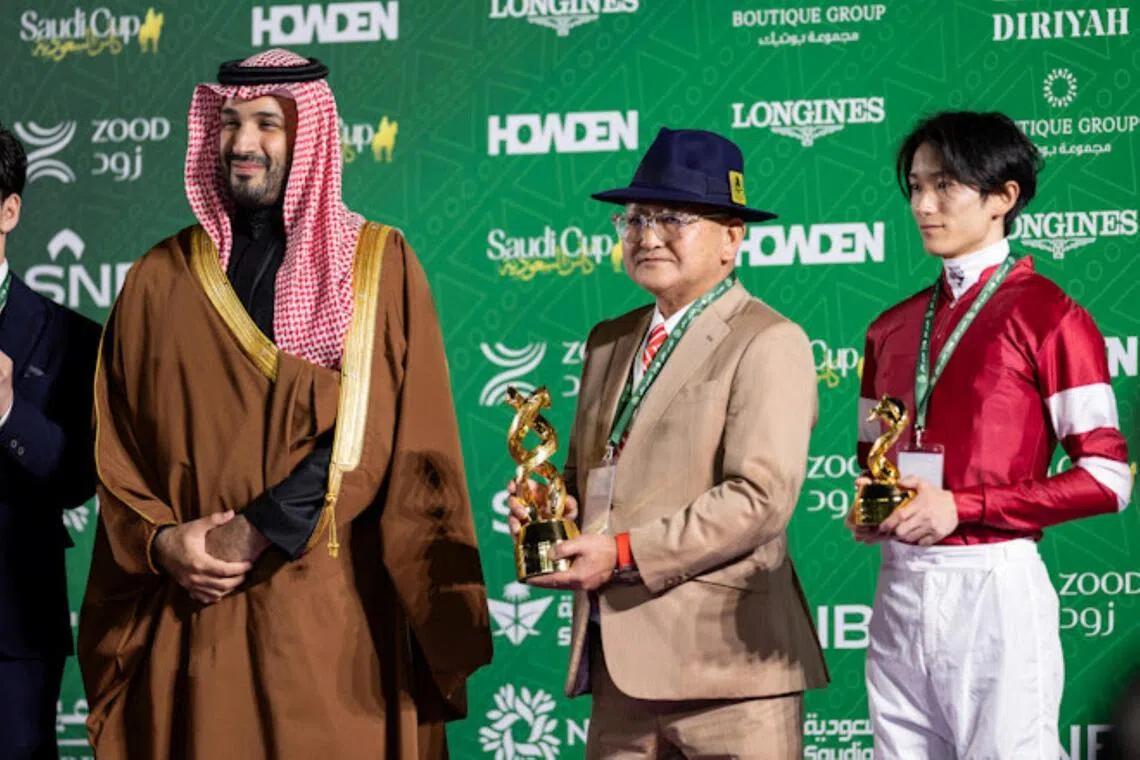 Yoshito Yahagi - Trainer Yoshito Yahagi receiving the 2025 Saudi Cup from His Royal Highness Prince Mohammed bin Salman bin Abdulaziz Al Saud, Crown Prince and Prime Minister of the Kingdom of Saudi Arabia, with jockey Ryusei Sakai looking on.

PHOTO: JOCKEY CLUB OF SAUDI ARABIA