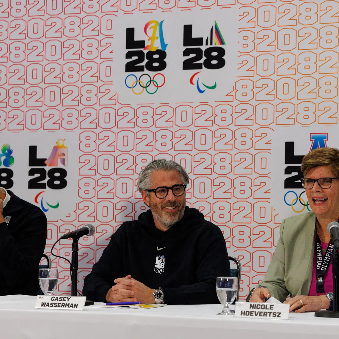 Nicole Hoevertsz, IOC Vice President and LA28 Coordination Commission Chair, speaks next to Casey Wasserman, LA28 Chairperson and President,  and Reynold Hoover, LA28 Chief Executive Officer, during a press conference following the conclusion of a three-day visit by the International Olympic Committee (IOC) Coordination Commission for the Olympic and Paralympic Games Los Angeles 2028, to select Games venues, track the progress of the LA28 Games and share insights on the progress and preparations in Los Angeles, California, U.S. June 5, 2025.  REUTERS/Mike Blake