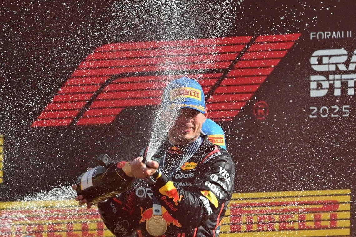 Red Bull's Max Verstappen celebrating on the podium after winning the Formula One Italian Grand Prix at Monza on Sept 7, 2025.