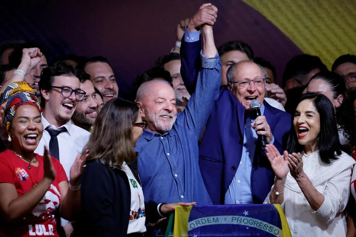 Brazilian President Luiz Inacio Lula da Silva celebrates with his wife Rosangela “Janja” da Silva and Vice-President Geraldo Alckmin after winning the presidential runoff election on Oct 25.