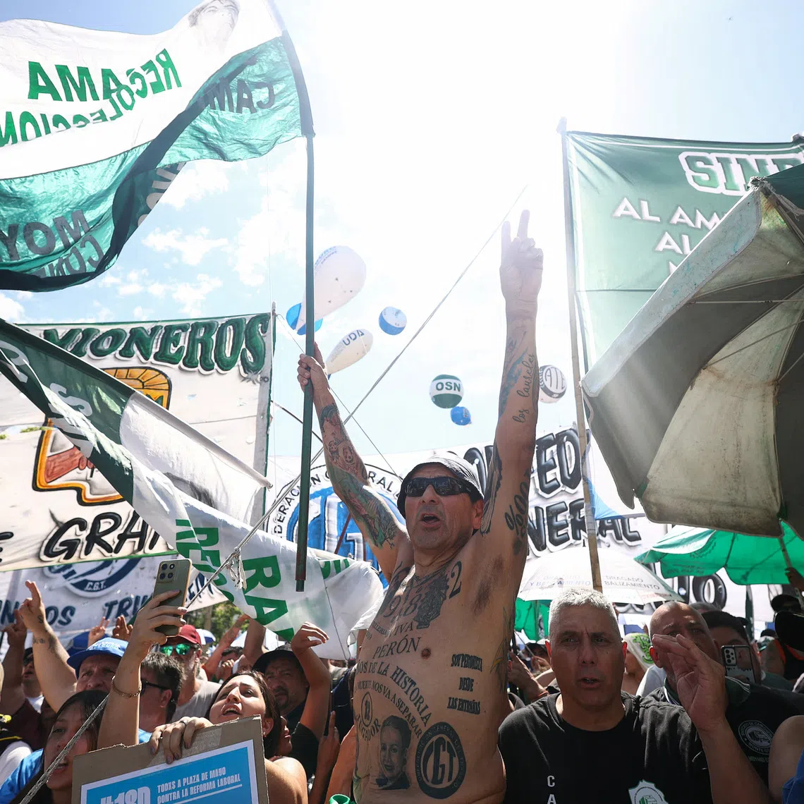 Demonstrators attend a protest organised by Argentina's General Confederation of Labor (CGT) against the government's proposed labour law reform, at Plaza de Mayo in Buenos Aires, Argentina, December 18, 2025. REUTERS/Tomas Cuesta