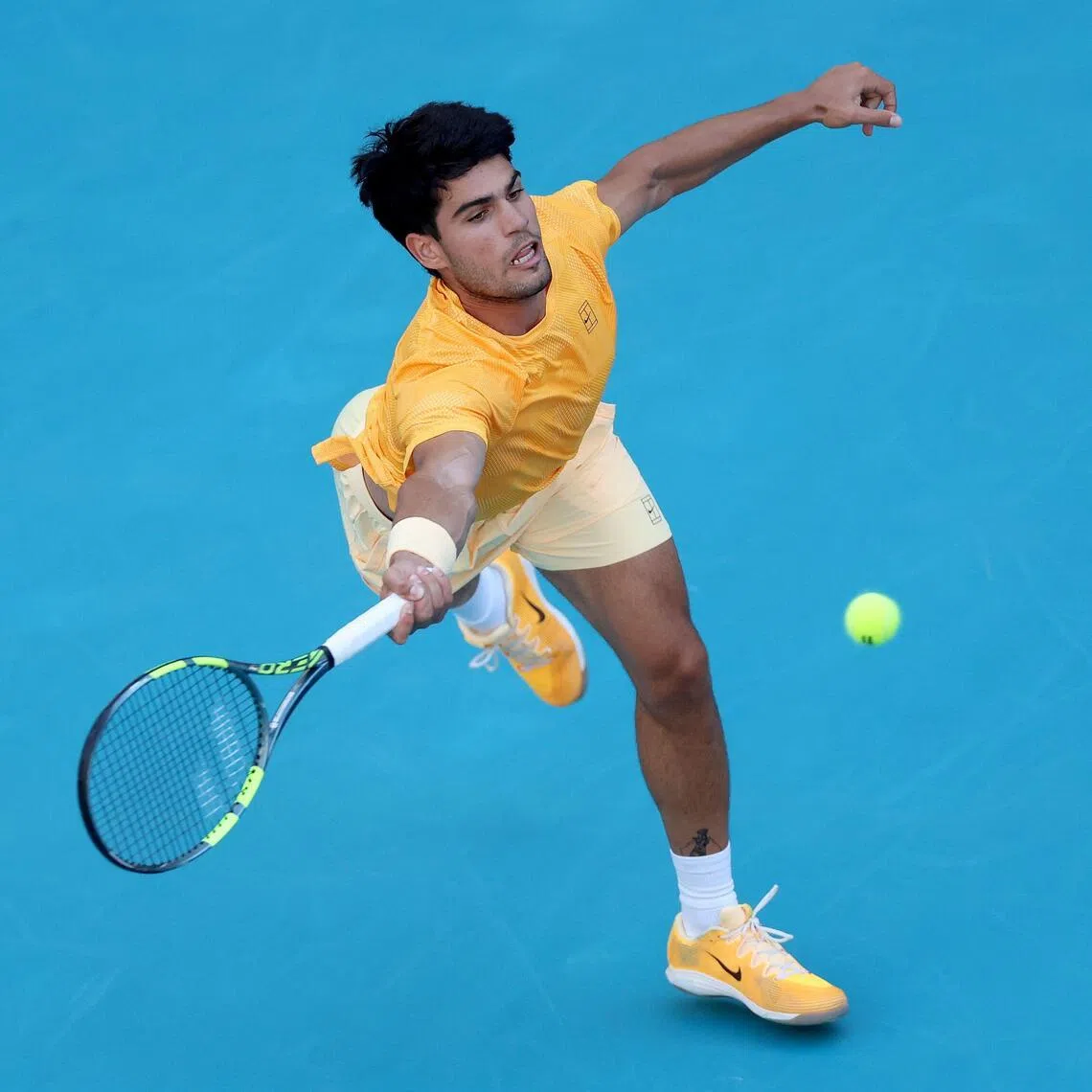 MIAMI GARDENS, FLORIDA - MARCH 22: Carlos Alcaraz of Spain lunges for a ball while playing Sebastian Korda of the United States on Day 6 of the Miami Open Presented by Itau at Hard Rock Stadium on March 22, 2026 in Miami Gardens, Florida.   Matthew Stockman/Getty Images/AFP (Photo by MATTHEW STOCKMAN / GETTY IMAGES NORTH AMERICA / Getty Images via AFP)