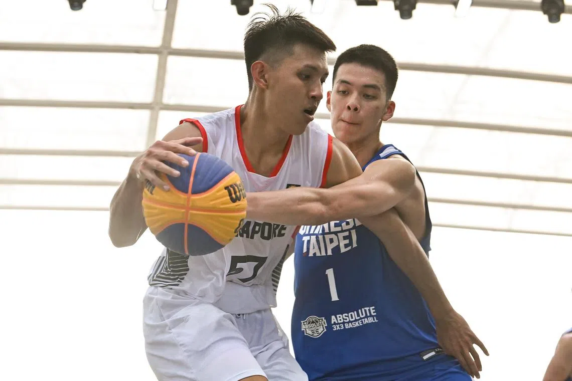 ST20230401-202395933772-Lim Yaohui-pixfiba/
Ng Shi Yu from Singapore (57) and Pu Kuo-Lun (1) from Chinese Taipei fighting for the ball.
Singapore vs Chinese Taipei - Men Pool A. Singapore won 22-20. Day 4 of FIBA 3x3 Asia Cup 2023 at OCBC Square on Apr 1, 2023.
FIBA 3x3 Asia Cup will be returning to Singapore, from 29 March to 2 April. In contrast to the 5v5 games or 13-player NBA matches, each 3x3 match is played by fewer players, of only 3 (and 1 on the bench) for each team, on a significantly smaller court. This sixth edition of the FIBA 3x3 Asia Cup will take place at the Singapore Sports Hub’s OCBC Square for the first time. It will feature 43 teams from 24 different countries and the emerging champions will earn a place in the qualifiers for the Paris 2024 Olympic Games.
(ST PHOTO: LIM YAOHUI)