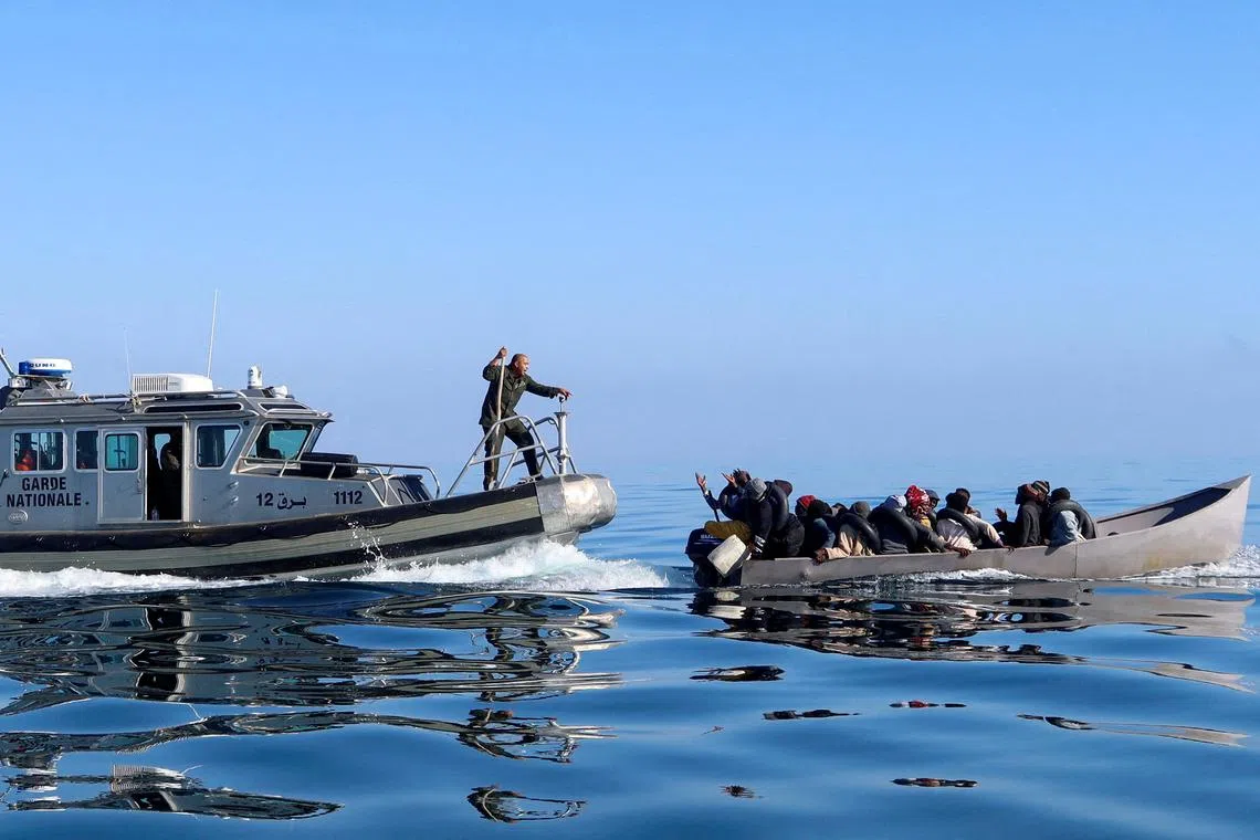 FILE PHOTO: Tunisian coast guards try to stop migrants at sea during their attempt to cross to Italy, off the coast off Sfax, Tunisia April 27, 2023. REUTERS/Jihed Abidellaoui /File Photo