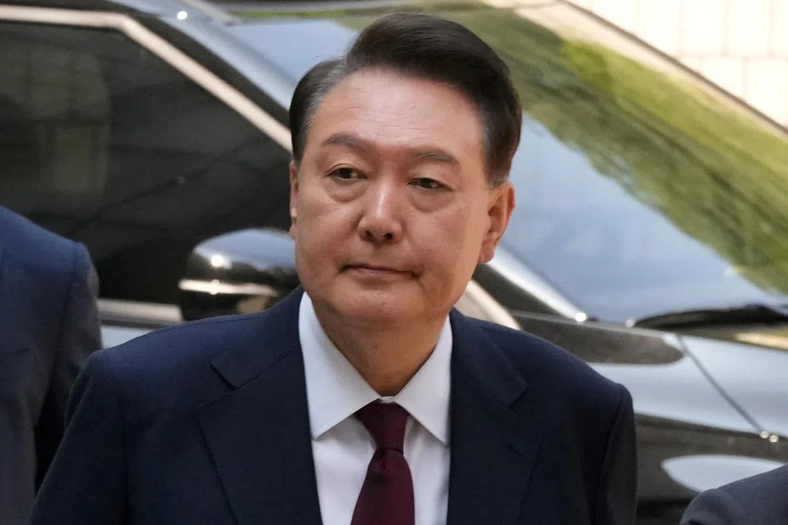 FILE PHOTO: South Korea's ousted President Yoon Suk Yeol, who is facing charges of orchestrating a rebellion when he declared martial law, arrives to attend his  trial at the Seoul Central District Court in Seoul, South Korea, Monday, May 12, 2025.     Ahn Young-joon/Pool via REUTERS/File Photo