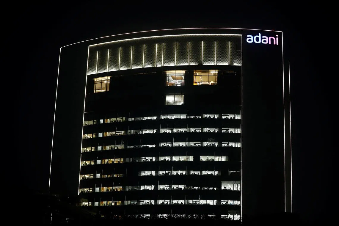 The logo of the Adani Group is seen on the facade of its Corporate House on the outskirts of Ahmedabad, India, January 27, 2023. REUTERS/Amit Dave