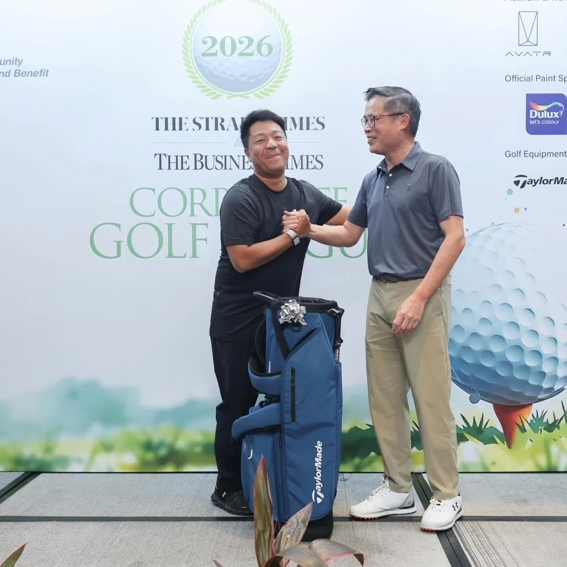 Henry Mo is all smiles after he receives the individual champion’s prize from Jaime Ho, editor of The Straits Times. 