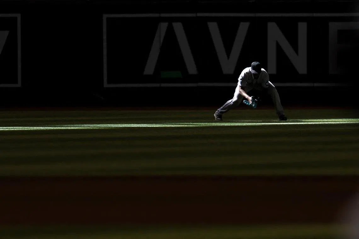 Bryan De La Cruz of the Miami Marlins fields a single hit by Nick Ahmed of the Arizona Diamondbacks during the ninth inning at Chase Field on May 10 in Phoenix, Arizona.  