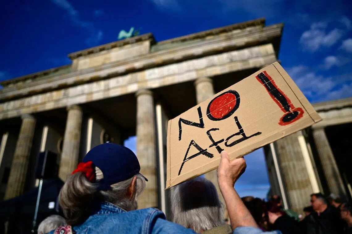 People protesting against the far-right AfD in front of the Brandenburg Gate in the German capital, Berlin, on Sept 7, a day after the AfD party scored its biggest win yet with 44 per cent of the vote in the Saxony-Anhalt state election.